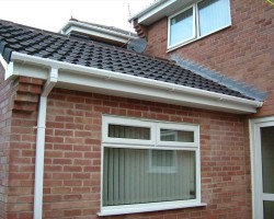 New white fascias, soffits and guttering fitted to a tiled roof extension