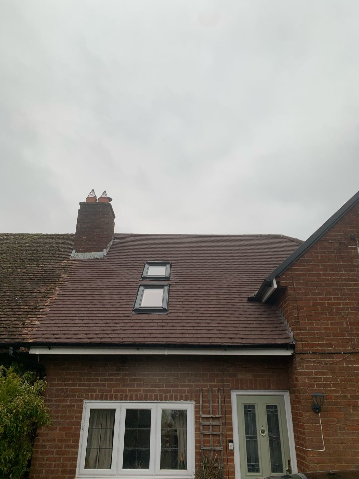 Re-roofed pitched tile roof with new skylights and chimney repointing
